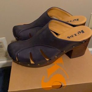 Blue leather clogs with a wooden heel